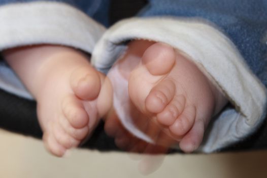 babies feet and toes showing movement as they are wiggled about