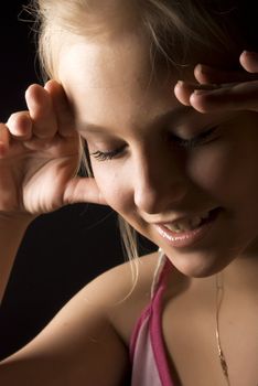 Portrait of a young beautiful blonde with closed eyes