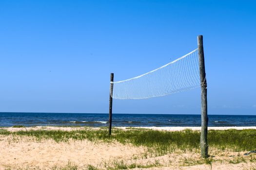 Volleyball net at the wild seashore