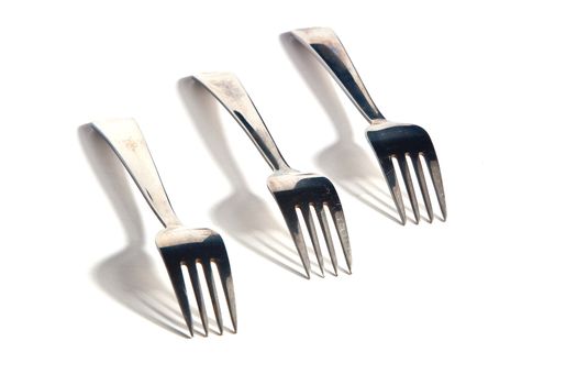 Three forks against white background. Cover set