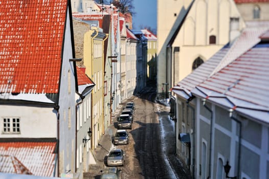 The narrow cobbled street and old houses