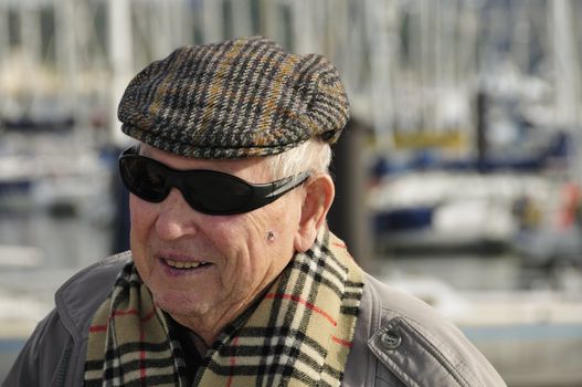 Old french senior man at the Yacht harbor in Brest, France.