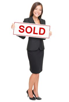 Real estate agent showing sold sign isolated on white background. Beautiful smiling Asian / Caucasian female realtor standing confident in full length.