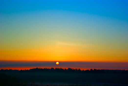 the dark red sunrise background with clouds