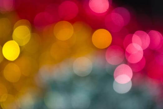 The colored abstract christmas lights as background