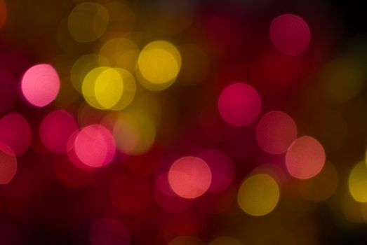 The colored abstract christmas lights as background
