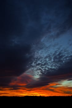 the dark red sunrise background with clouds