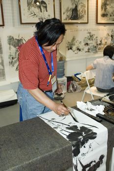 CHINA, GUANGDONG, SHENZHEN - MAY 16, 2009: China Culture Exhibition, showing Chinese art, traditions, folk music, costumes, modern art, opera, different minorities. Photo presents traditional Chinese ink paintings.