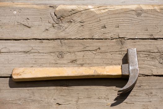 hammer on old grunge wooden floor