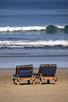 Inviting wooden chairs on a Bali beach