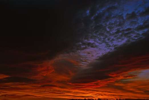 the dark red sunrise background with clouds