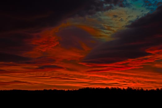 the dark red sunrise background with clouds