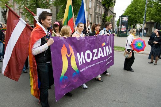 RIGA, LATVIA, MAY 16, 2009: Gay men and women and their supporters at parade in the Latvian capital, accompanied by a strong police presence and loud protest from anti-gay activists.