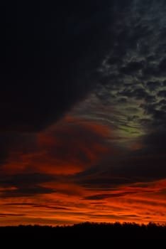 the dark red sunrise background with clouds