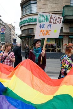 RIGA, LATVIA, MAY 16, 2009: Gay men and women and their supporters at parade in the Latvian capital, accompanied by a strong police presence and loud protest from anti-gay activists.