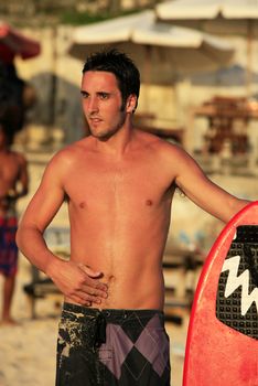 Portrait young men - the surfer pending waves