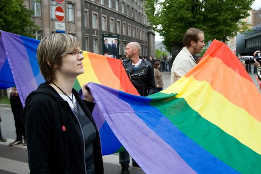 RIGA, LATVIA, MAY 16, 2009: Gay men and women and their supporters at parade in the Latvian capital, accompanied by a strong police presence and loud protest from anti-gay activists.