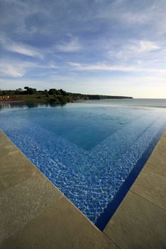 Blue water in the swimming pool passing in ocean