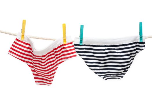 Colour undershorts hung on linen rope with clothes-peg