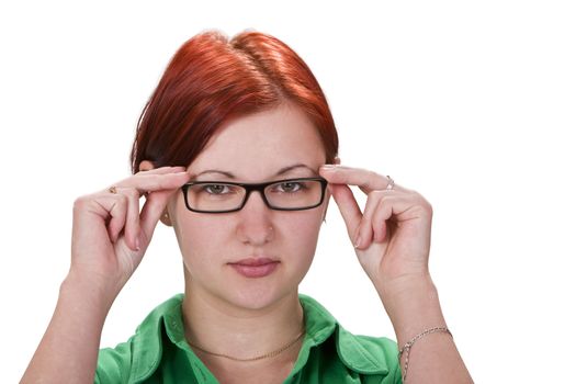 Portrait of a redheaded girl with glasess against a white background.Shot with Canon 70-200mm f/2.8L IS USM