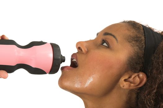 Beautiful woman drinking after her workout