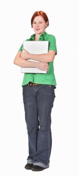 Redheaded girl student hugging her laptop. 
