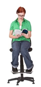 Image of a redheaded teenager sitting on a high chair and reading a book.Shot with Canon 70-200mm f/2.8L IS USM