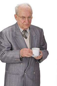 Senior man with a cup of tea.Shot with Canon 70-200mm f/2.8L IS USM