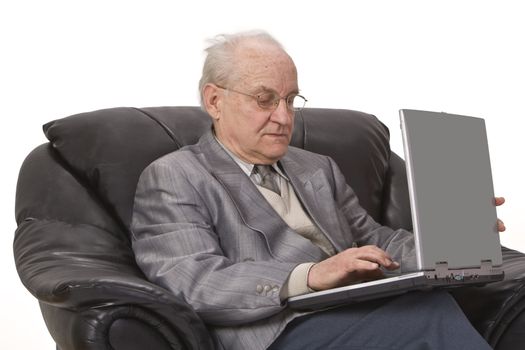 Close-up image of a senior man using a laptop.Shot with Canon 70-200mm f/2.8L IS USM