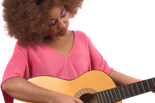 Beautiful afro woman playing her guitar