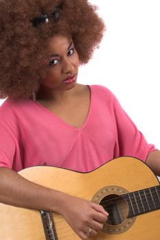 Beautiful black woman with afro hair and guitar