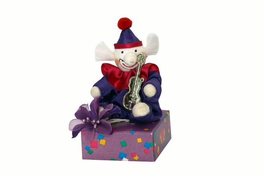 Colorful clown sitting on a box on a white background