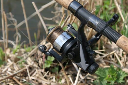 Closeup of fishing reel outdoors