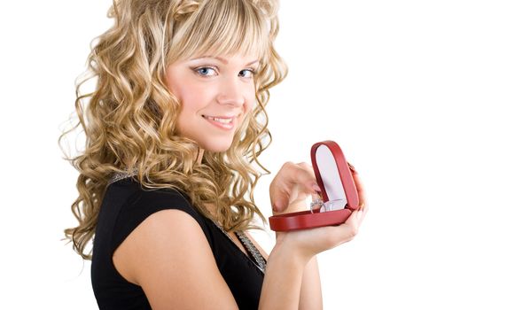 young friendly blond girl holding box with wedding ring