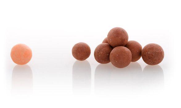 Close-up of face powder balls on isolated background