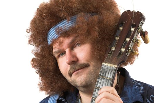 Man posing with his guitar in his hand