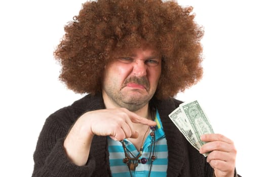 Old hippie looking at the money in his hand with a dirty look on his face