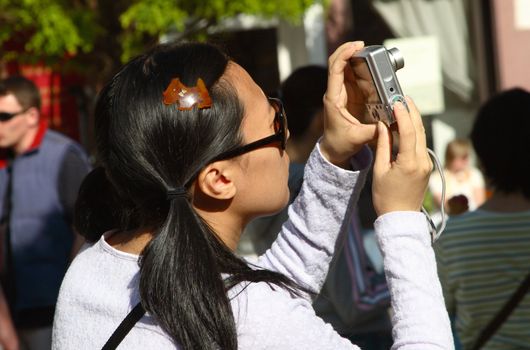 young asian girl with new photocamera