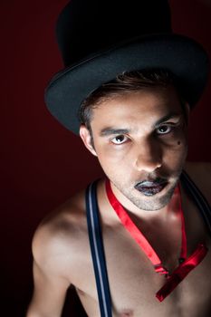 man with black lips and a top hat