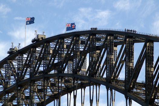 bridge walking on harbour bridge in sydney, australian flags