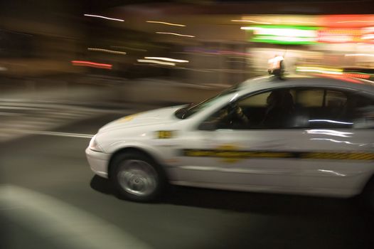 night shot of speeding taxi in sydney