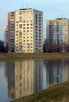 community house and its reflection in water, photo taken in Humenne, Slovakia