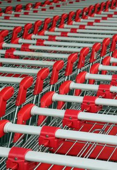 parked shopping trolleys, red and grey color