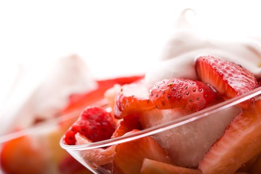 Strawberry shortcake in a martini glass sponge cake and whip cream