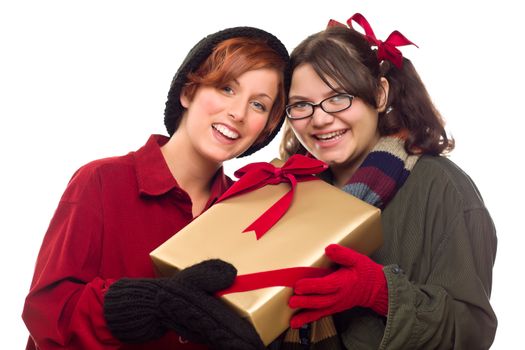 Two Pretty Girlfriends Holding A Holiday Gift Isolated on a White Background.