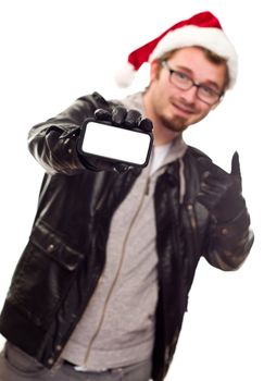 Smiling Young Man with Santa Hat Holding Out Blank Cell Phone Isolated on a White Background.