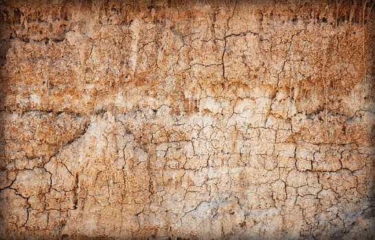 Background - brown clay soil with cracks and stains