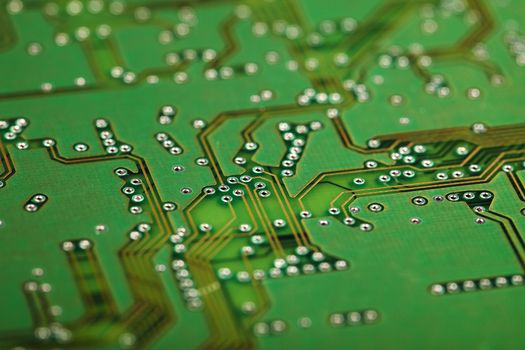 Circuit board close up - a green industrial background