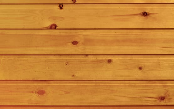 The background of the smooth wooden planks arranged horizontally