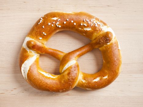 typical german pretzel on a wooden plate